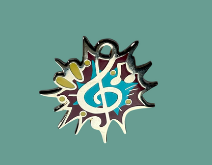 Reward pin for Piano, guitar, violin or drum lessons, has a Treble clef and notes in gold metal.
