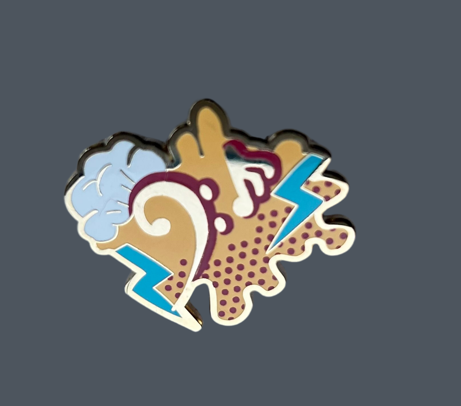 Reward pin for Piano, guitar, violin or drum lessons, has a Bass clef and notes in gold metal.